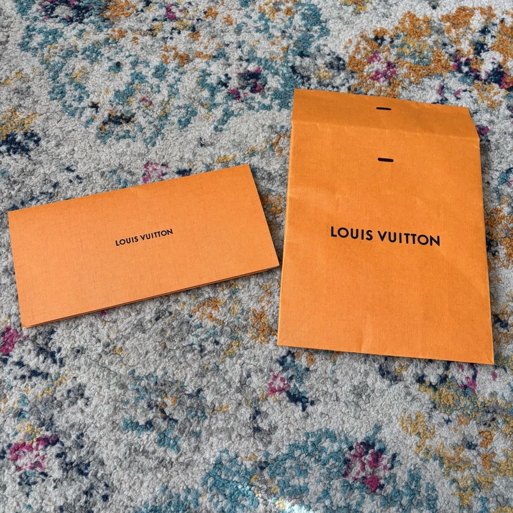 Louis Vuitton shopping bag and receipt envelope